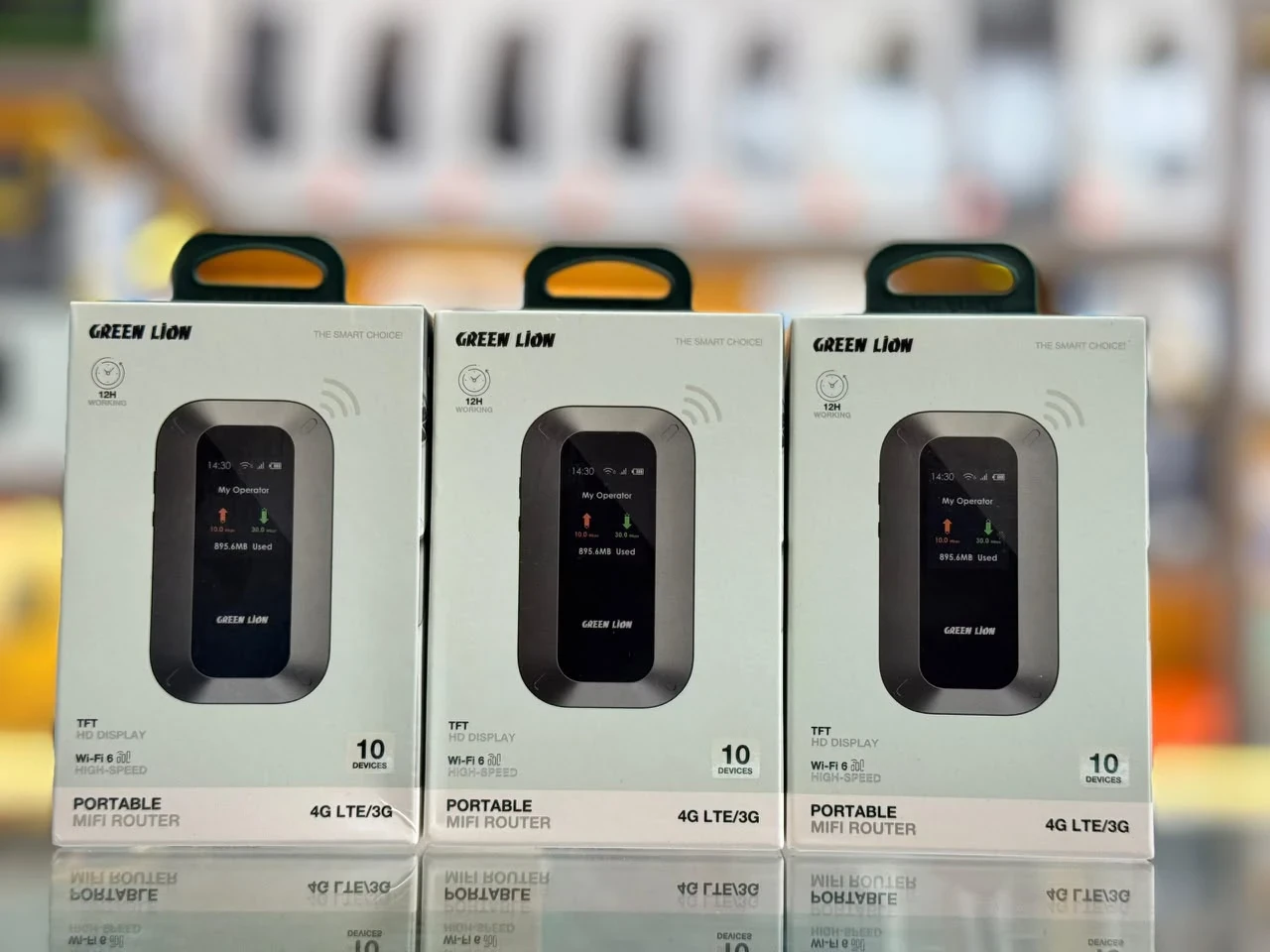 Green Lion Connect 4G LTE MiFi Router; EMOS stock photograph of sealed Green Lion Portable MiFi Router retail packaging with hardware pictured on the boxes. This is a same-brand portable 4G LTE router reference, not a photograph of the exact Green Lion Connect unit. The pictured package does not verify its 1.44-inch display, 4000mAh battery or included accessories.
