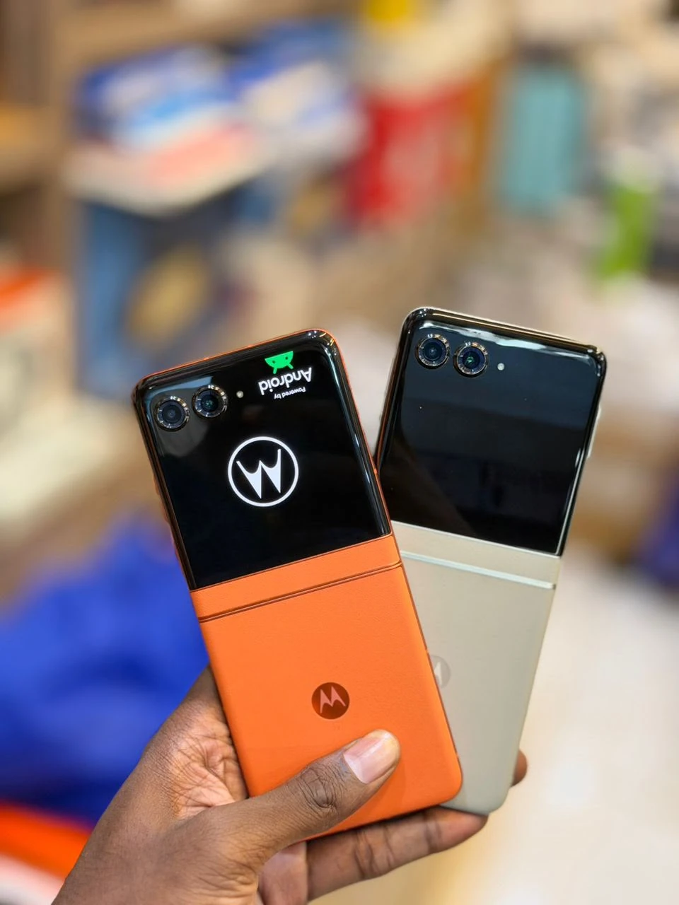 Motorola Razr 50s pre-owned foldable phone stock, shown folded with the outer display active